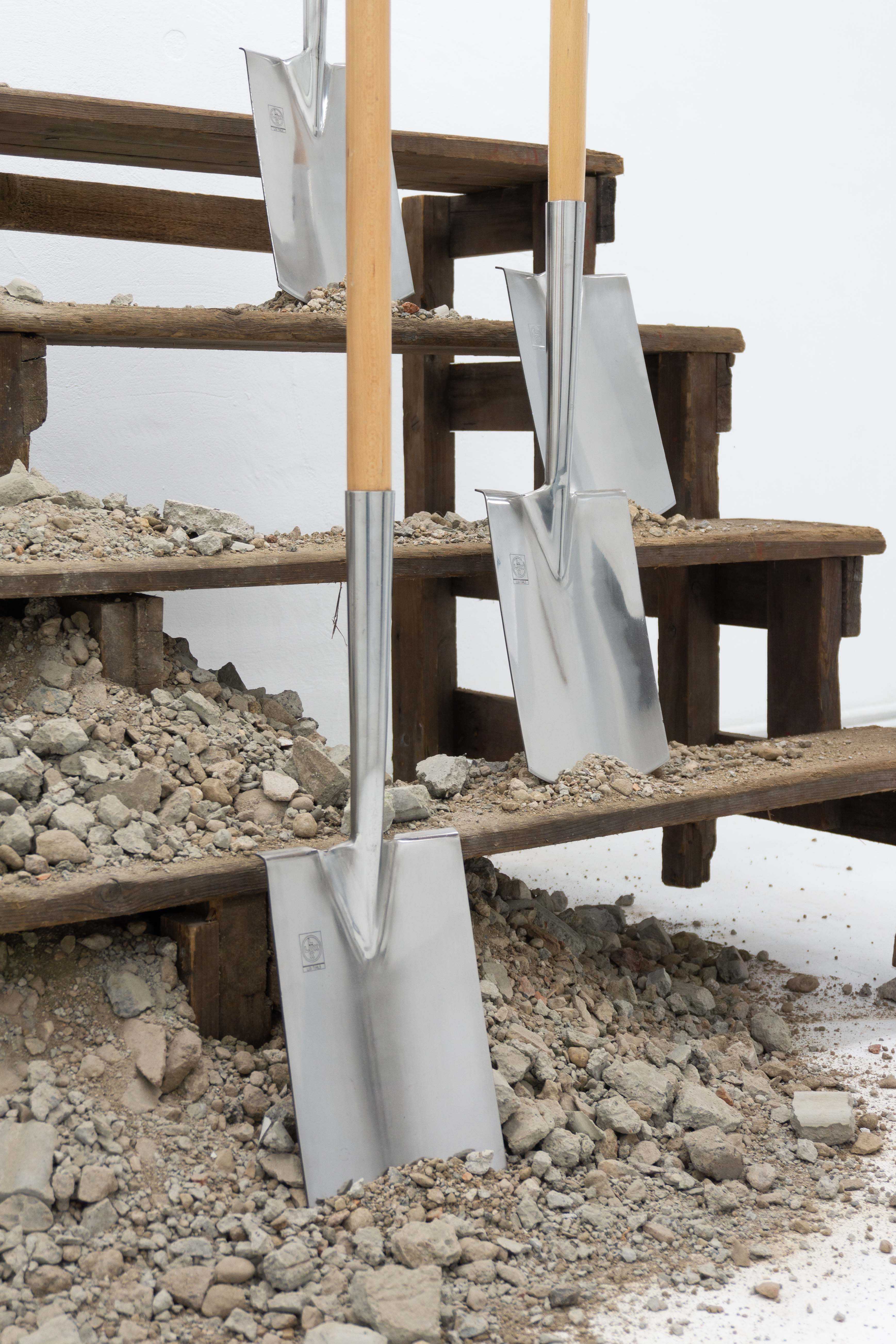 Detail view of 'Angehörige', 2026, wooden stairs, eight spades, concrete recycling, 200 x 117 x 213 cm, by Mathias Weinfurter, DOD Gallery, Cologne, 2026