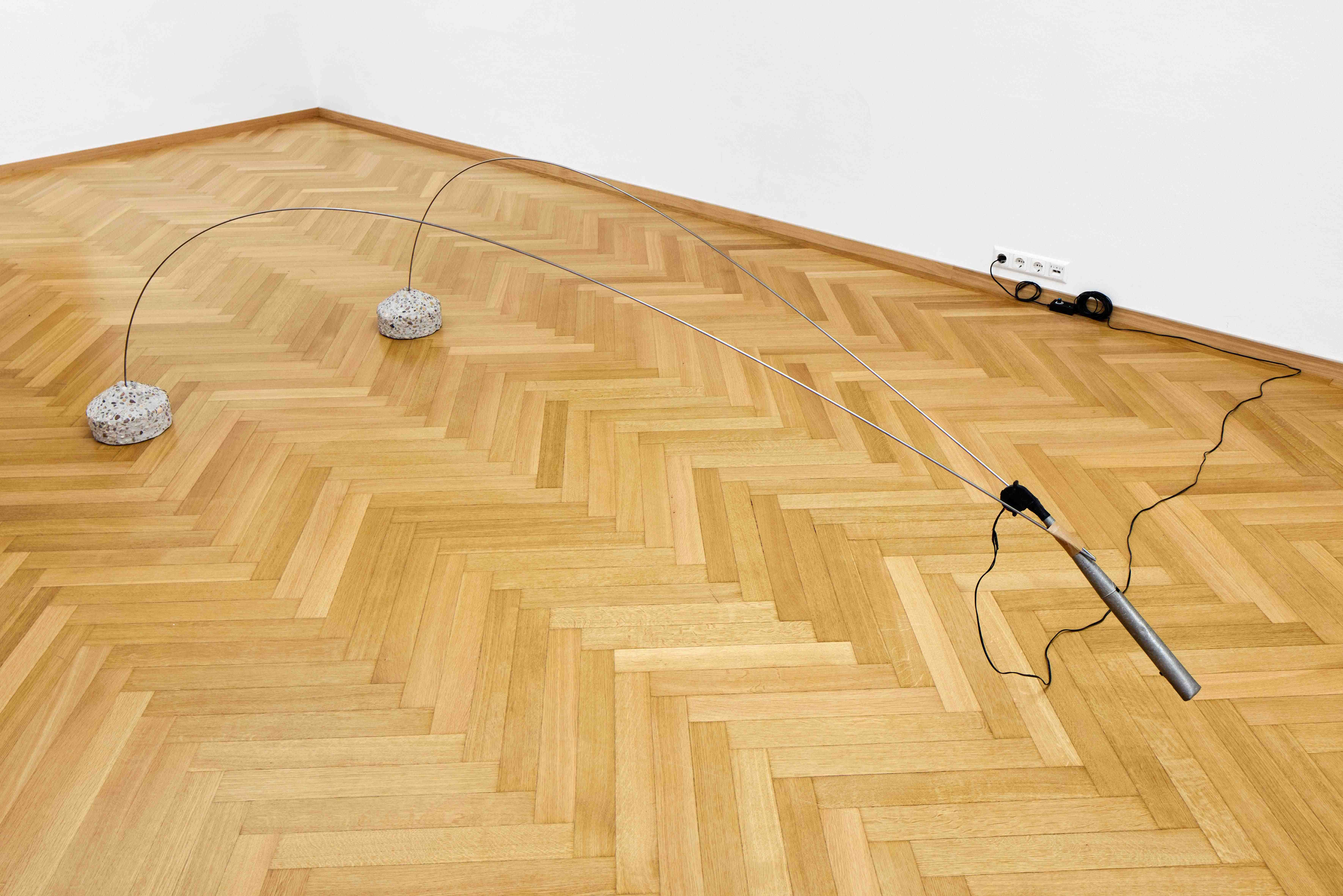 Miriam Steinmacher „Die Meritokraten“, 2026, Organ pipes, wire, radial blower, exposed aggregate concrete base, packing tape, controller, variable dimensions