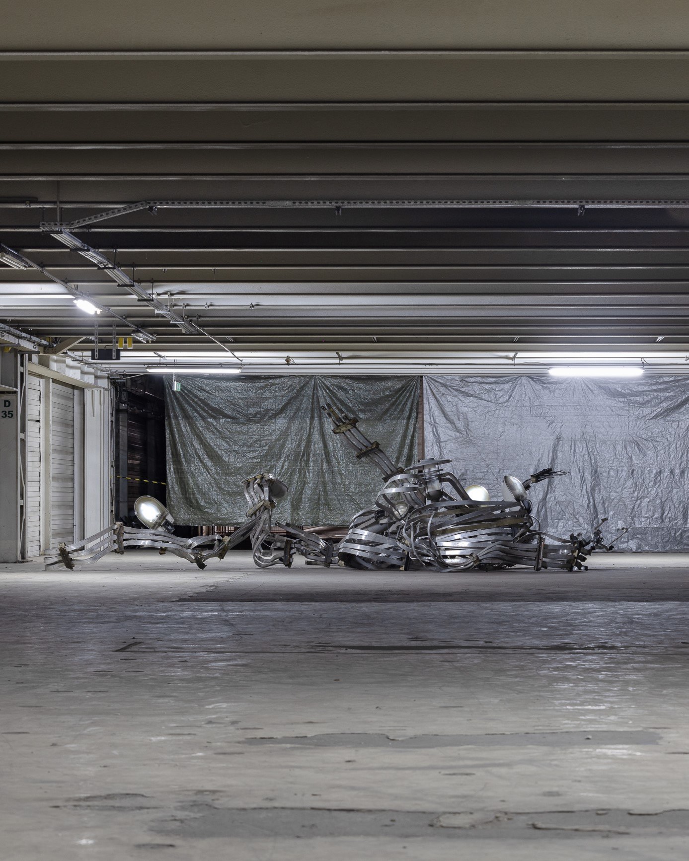2026 / 6 m x 6 m x 2.3 m / aluminum, steel, street lamp shades, electronics / Photography: Zuza Wudarska