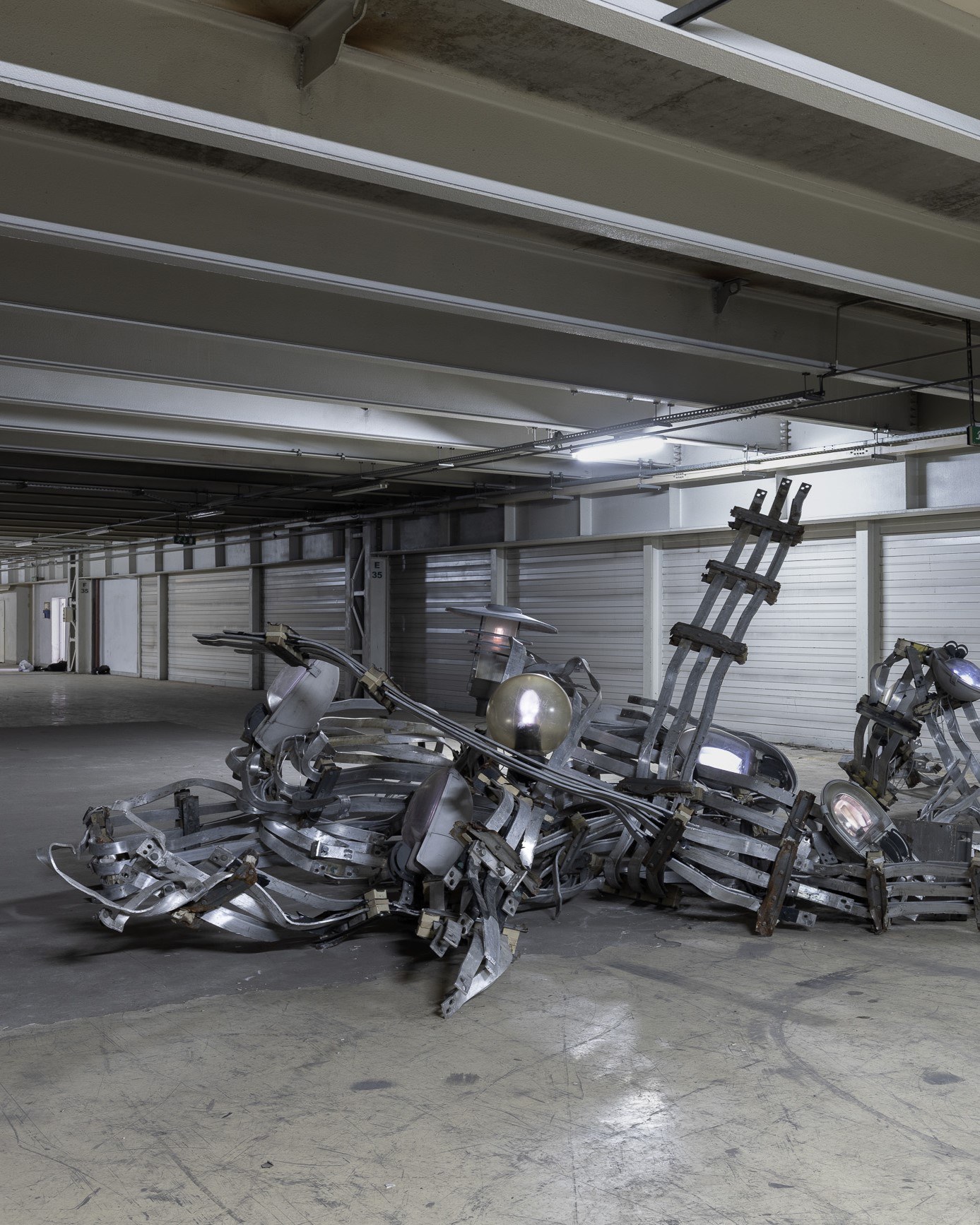 2026 / 6 m x 6 m x 2.3 m / aluminum, steel, street lamp shades, electronics / Photography: Zuza Wudarska
