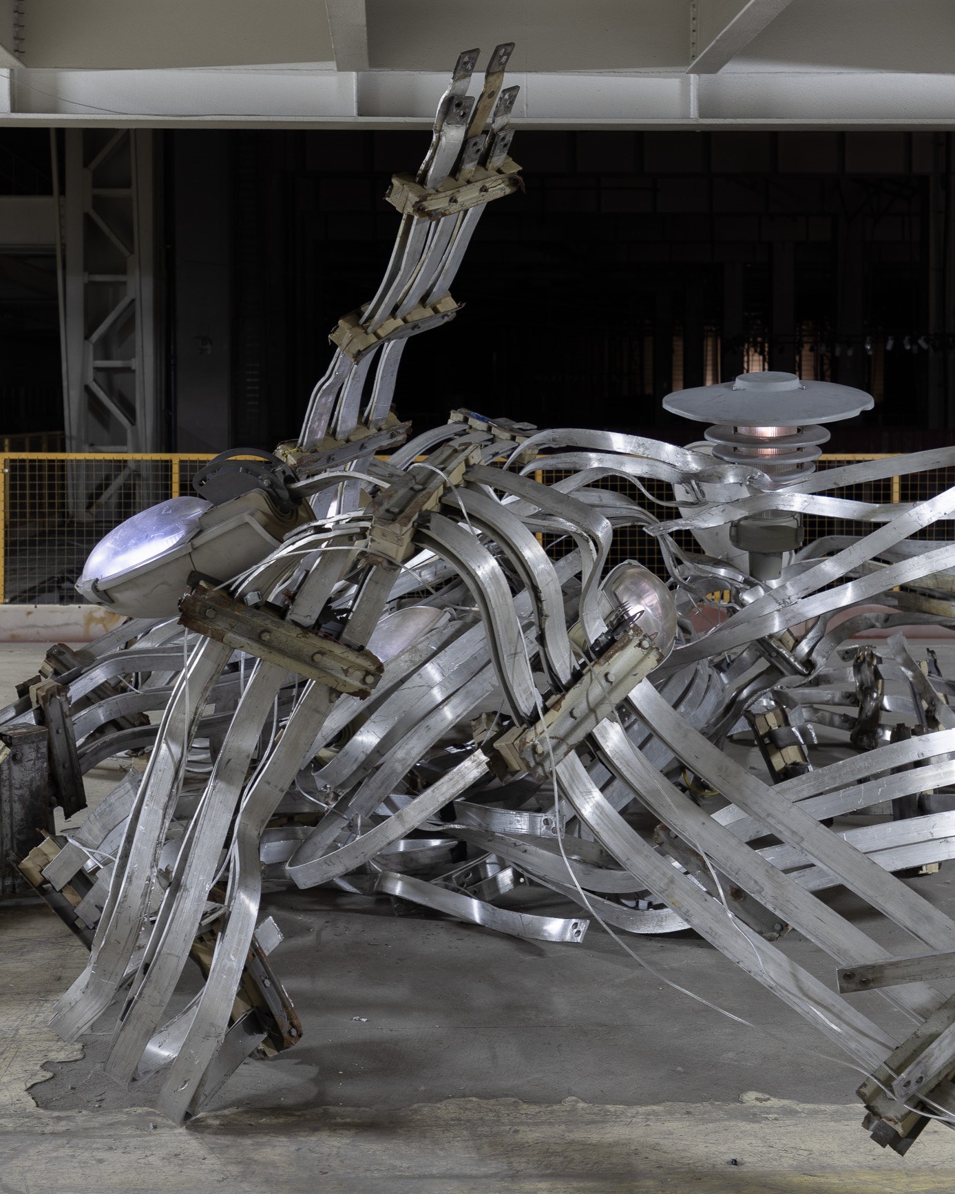 2026 / 6 m x 6 m x 2.3 m / aluminum, steel, street lamp shades, electronics / Photography: Zuza Wudarska