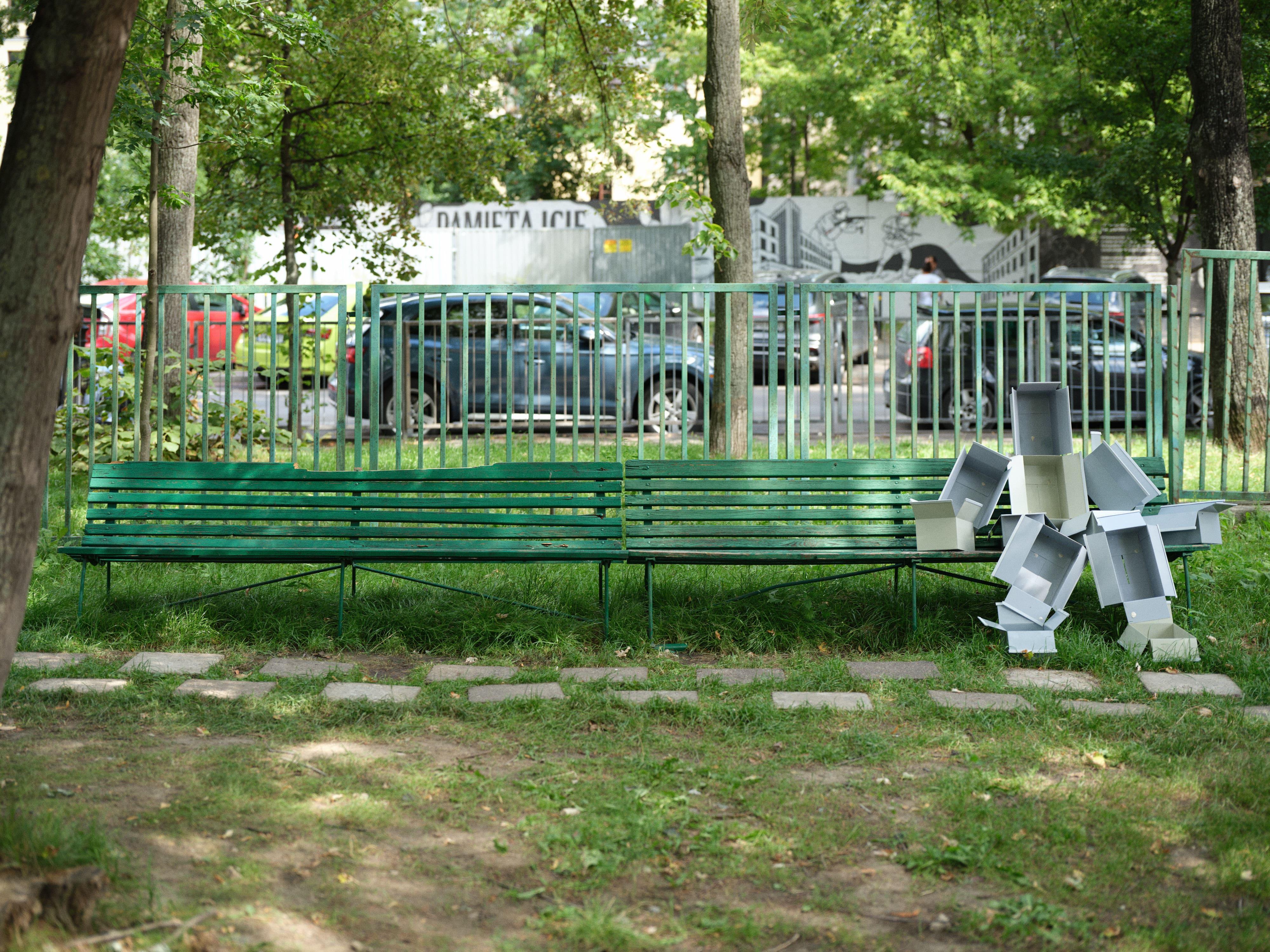 Piotrek Kowalski, _12 boxes_, 2026, painted steel, chewing gum, bench, 110 × 145 × 120 cm