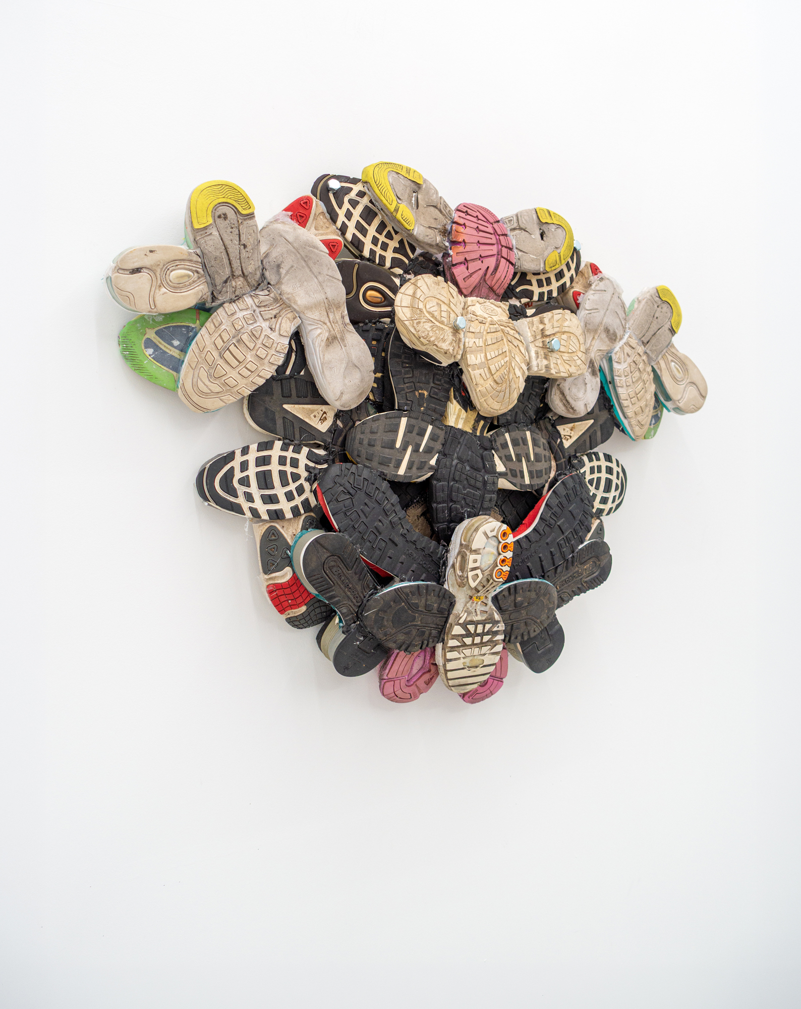 Mascha Naumann · grounded 4 · Sneaker soles & metal · 74 × 106 × 19 cm · 2026