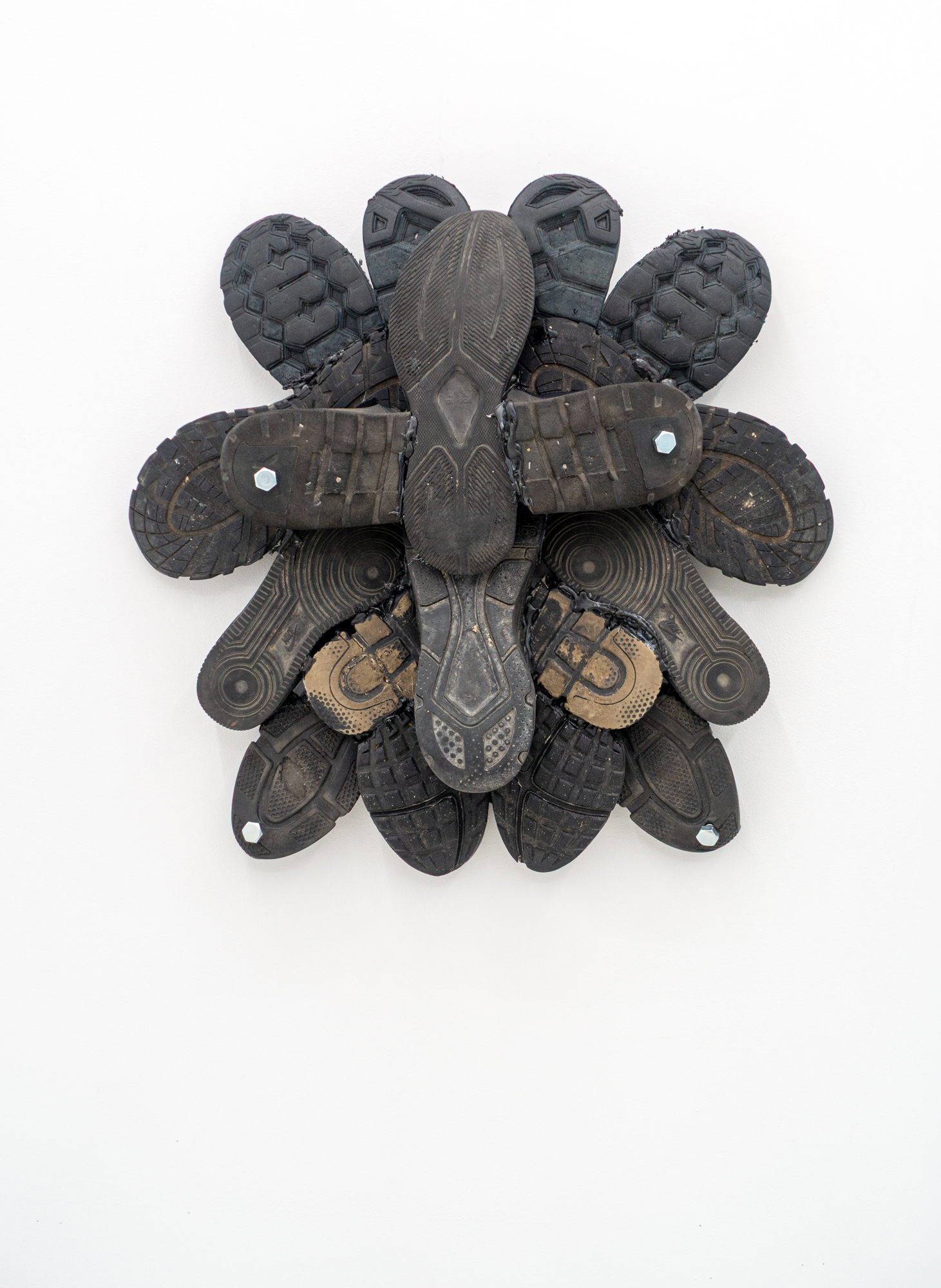 Mascha Naumann · grounded 3 · Sneaker soles & metal · 59 × 58 × 14 cm  · 2026