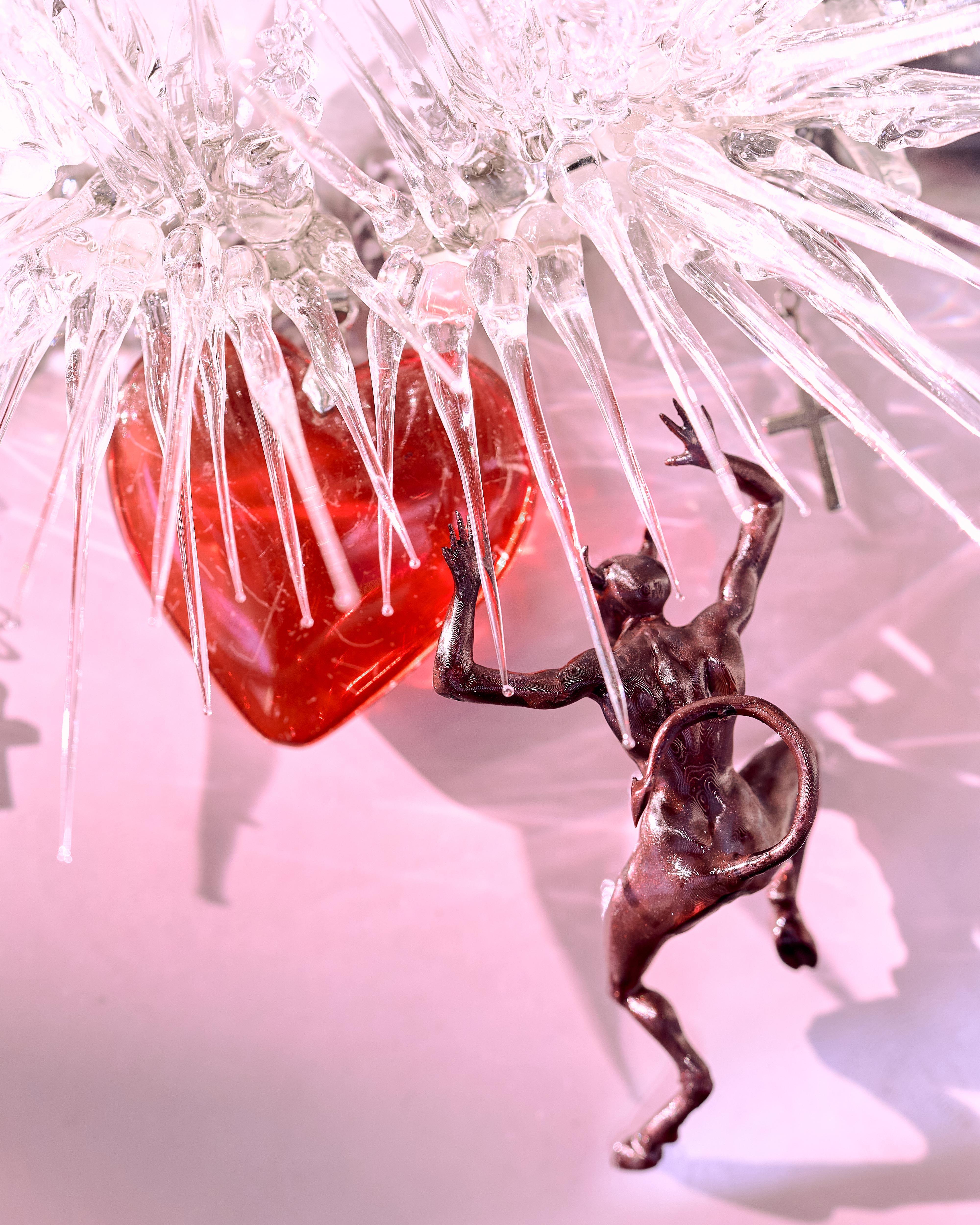 Cursed but Pretty, 2026, AI-generated print on paper, glass, 3D printing, photopolymer resin, old red heart necklace 