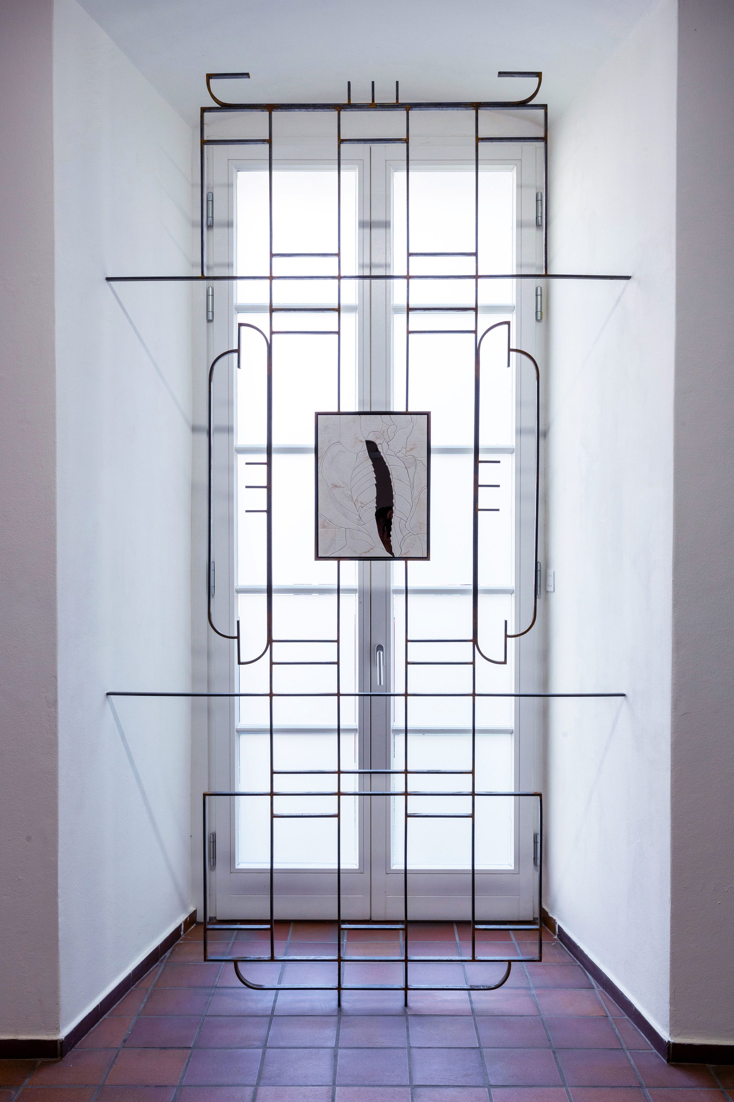 Reversed View, 2026, Sculpture made of steel, Natural Acrylic Stone, and bronze mirror, 106 x 280 cm