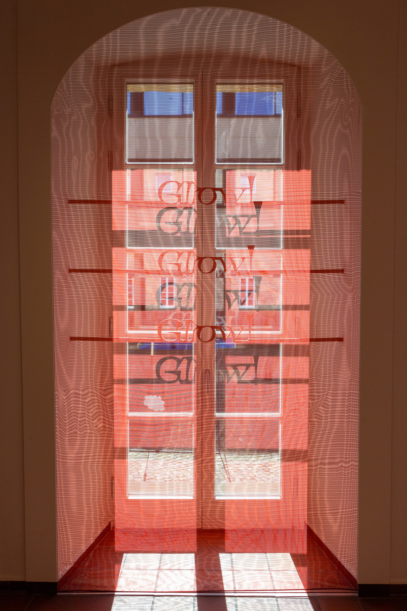 Traversing Poem, 2026, Installation on 12 windows: Poem and frame elements made of MDF, fabric made of polyester and copper thread, Dimensions Variable