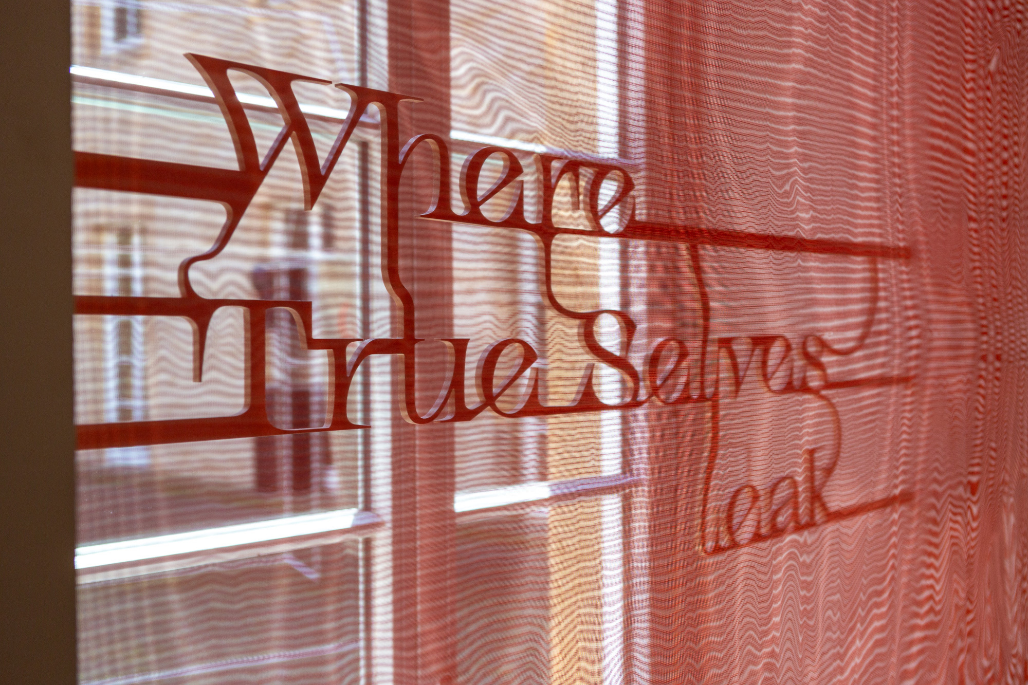 Traversing Poem, 2026, Installation on 12 windows: Poem and frame elements made of MDF, fabric made of polyester and copper thread, Dimensions Variable