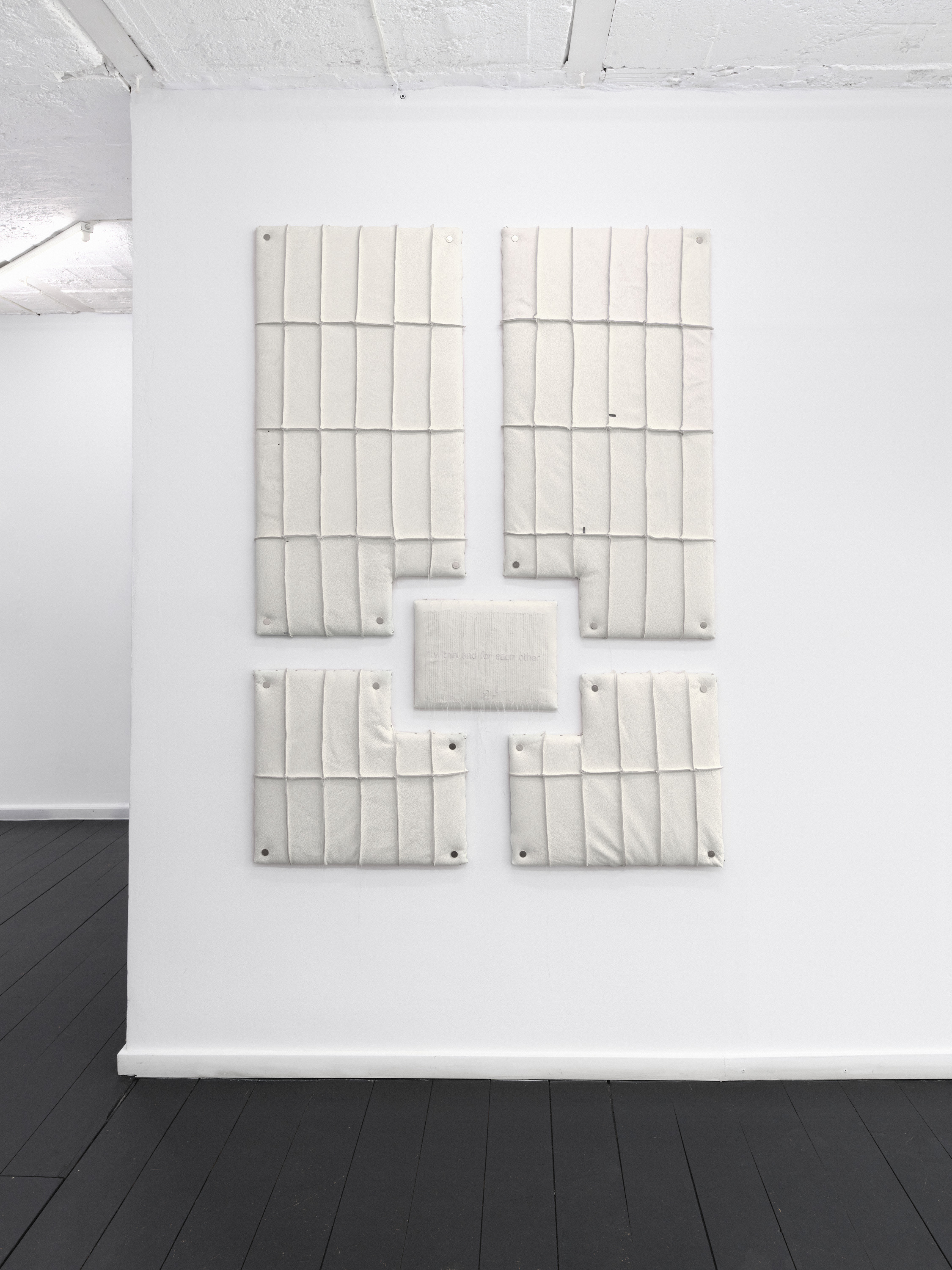 Relief 03 (2026). OSB Board, Upholstery Foam, Recycled Leather, Polyester Thread. 160 x 120 x 5 cm. 