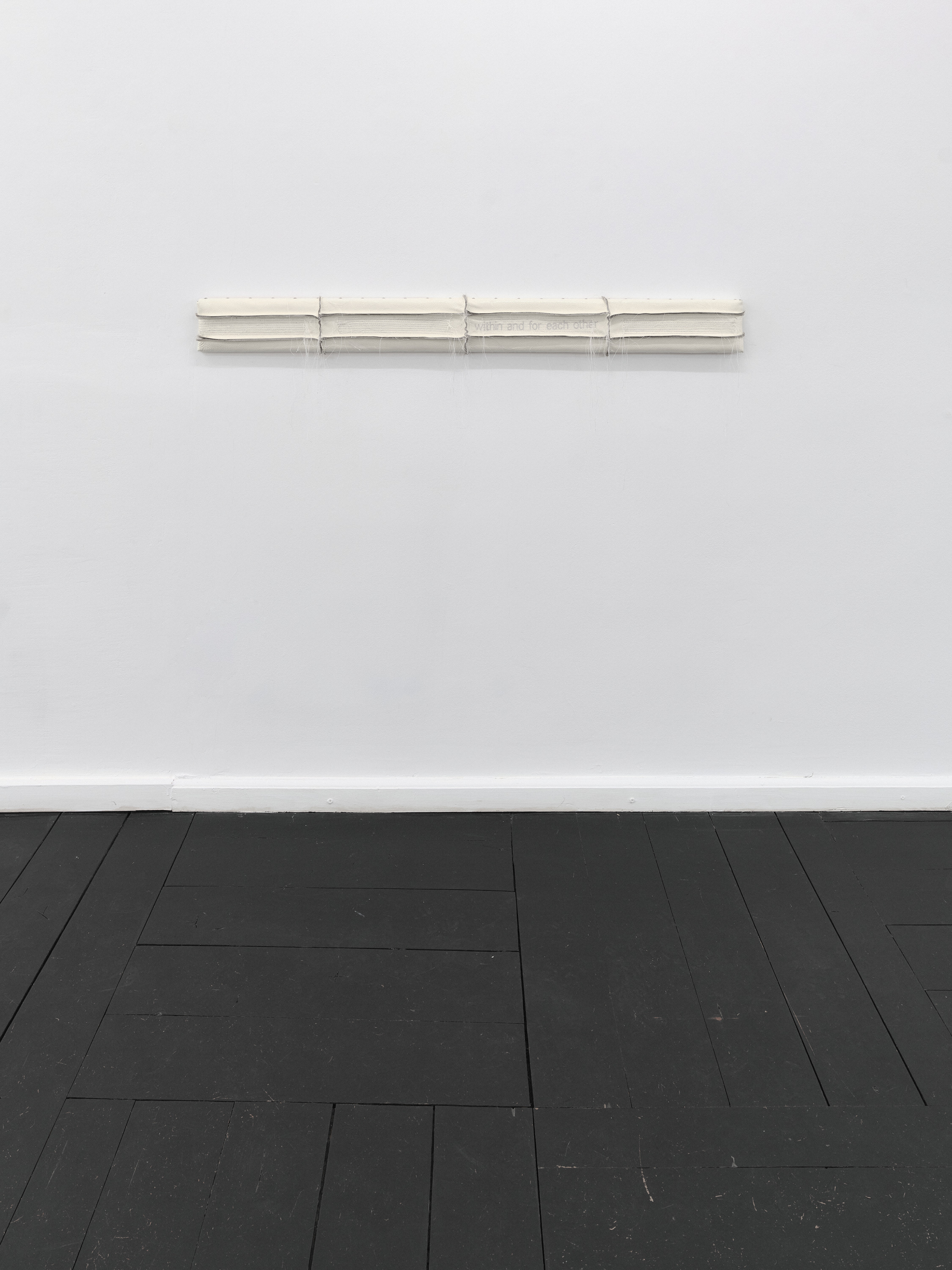 Relief 02 (2026). Pine Wood, Upholstery Foam, Recycled Leather, Polyester Thread, Lacquer. 10 x 5 x 120 cm