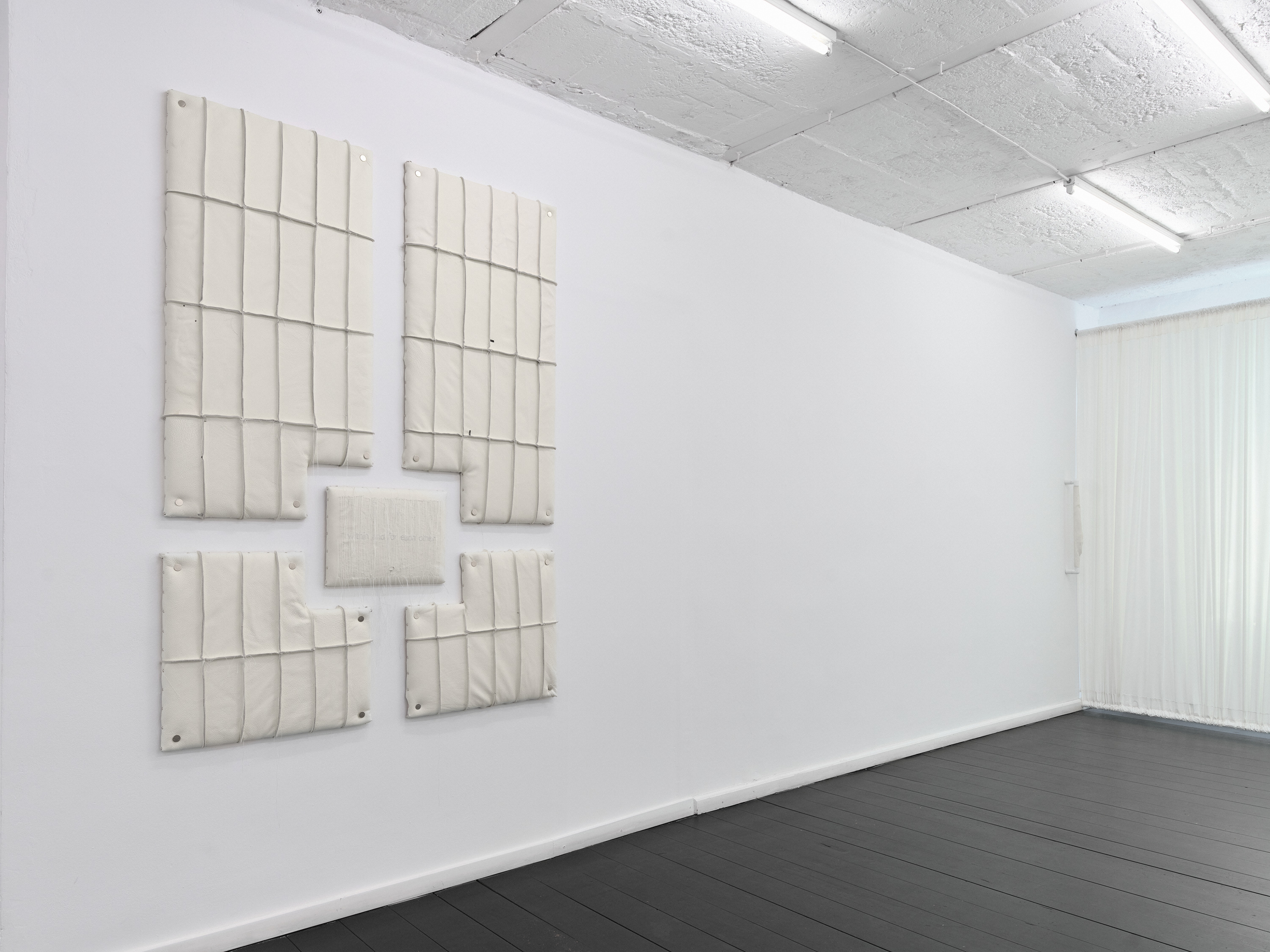 Relief 03 (2026). OSB Board, Upholstery Foam, Recycled Leather, Polyester Thread. 160 x 120 x 5 cm. 