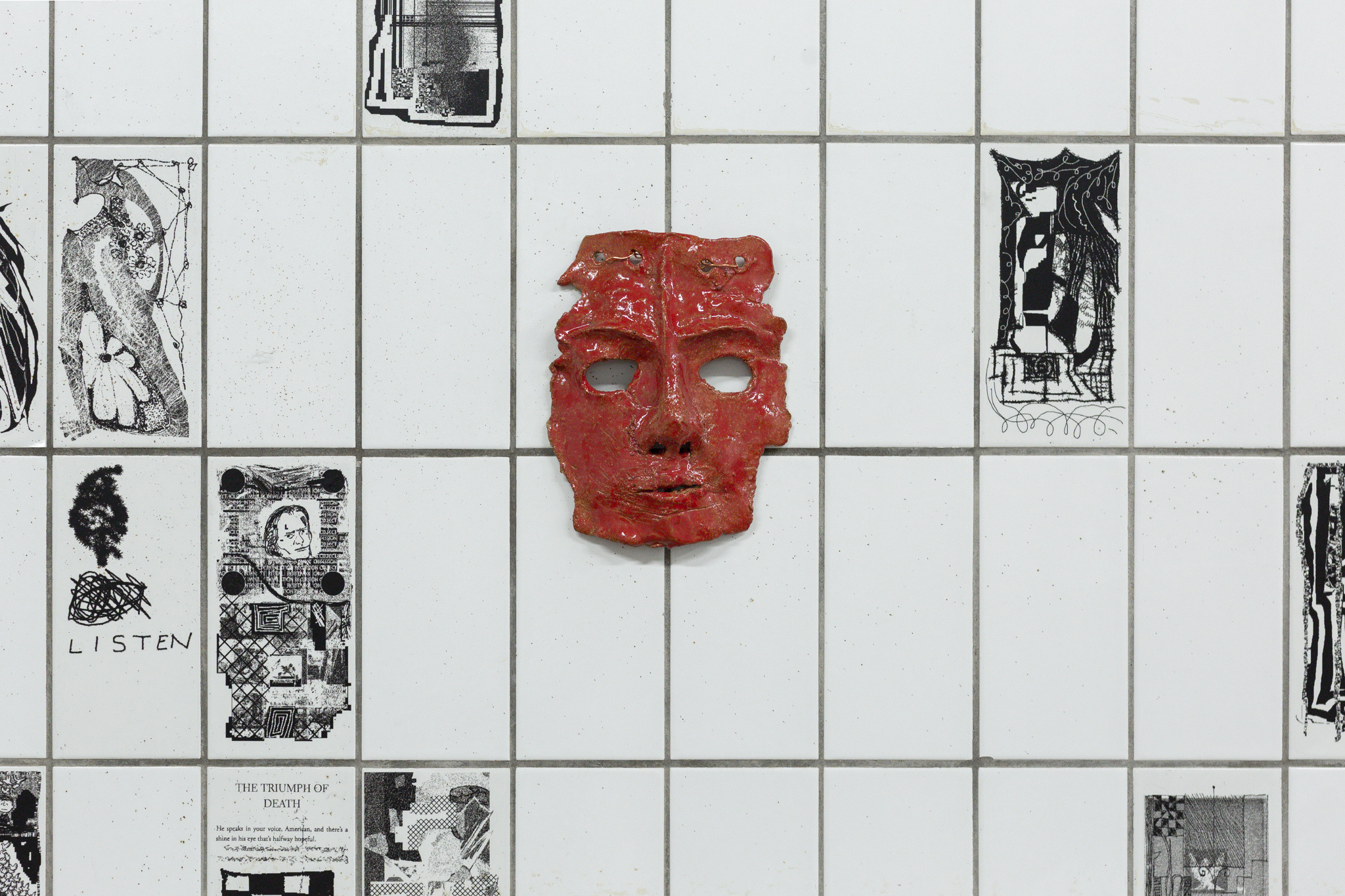 Jaakko Pallasvuo: Eternal Return, 2026, installation, dimension variable, bespoke paint software, 350 digital images reproduced as transparent stickers, three ceramic masks, red glaze