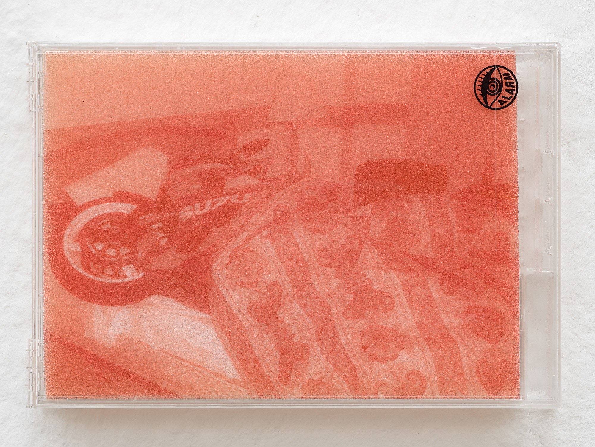 Billie Clarken, There Is No Cure (Chewing Tongue Series), 2026, UV print on foam, locked acrylic DVD security box, 14.8 × 21.5 × 2.2 cm © the artist and Galerie Brugger Photo: Juri Löchte