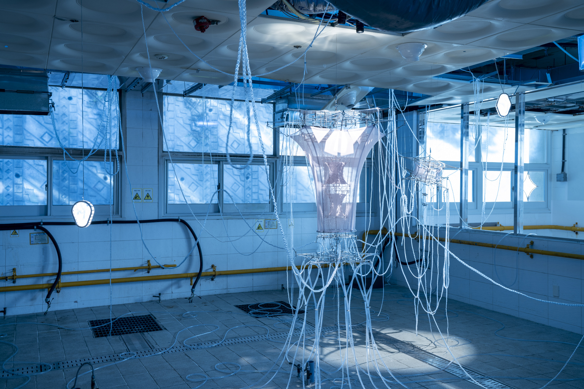 We Were Trembling as If in Cold Water, 2026, two-channel sound installation; fabric, stainless steel, PVC, LED, hose, water pump and air circulation system, dimensions variable. Commissioned by Busan Biennale Organizing Committee, 2026.
