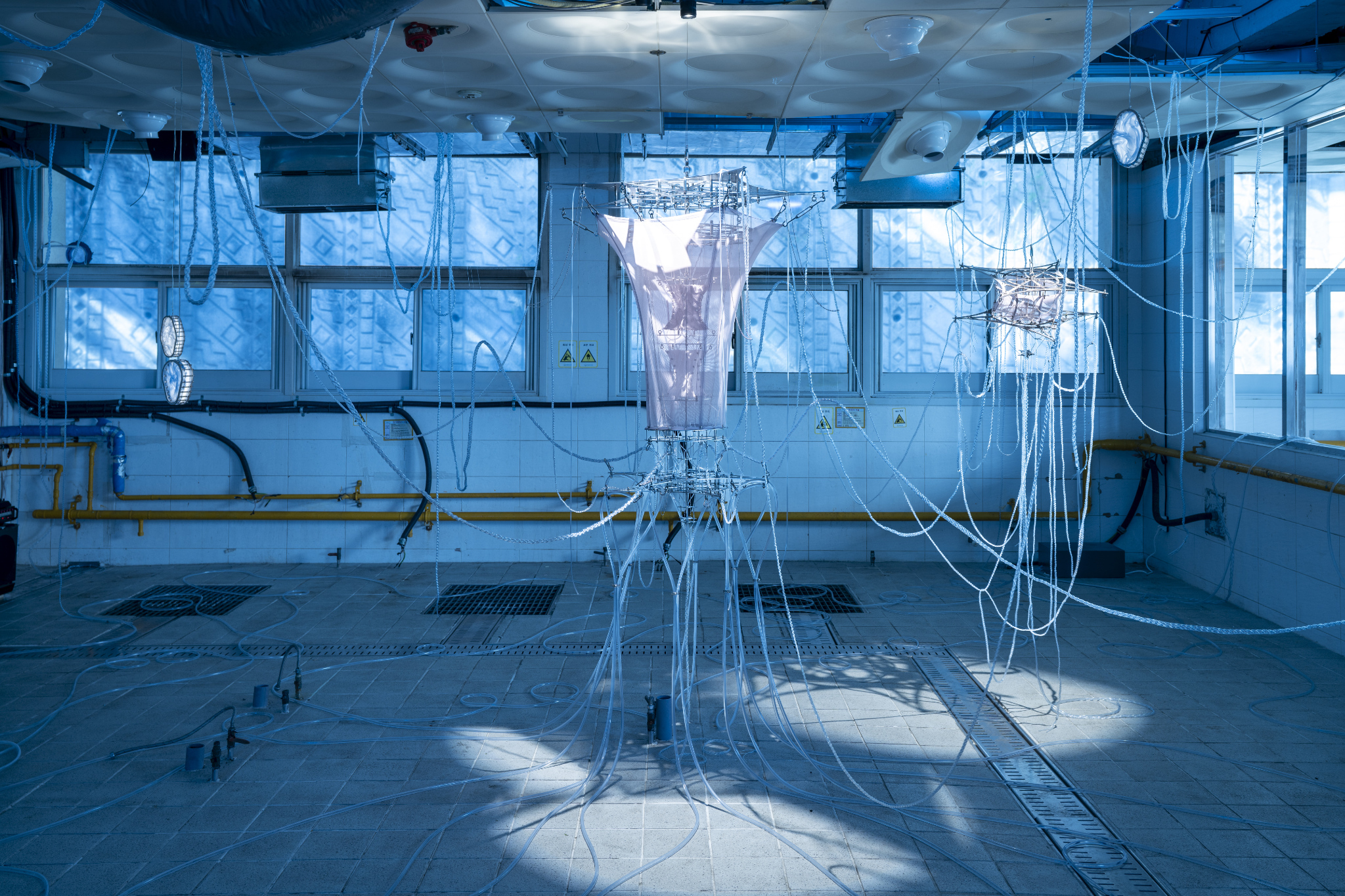 We Were Trembling as If in Cold Water, 2026, two-channel sound installation; fabric, stainless steel, PVC, LED, hose, water pump and air circulation system, dimensions variable. Commissioned by Busan Biennale Organizing Committee, 2026.