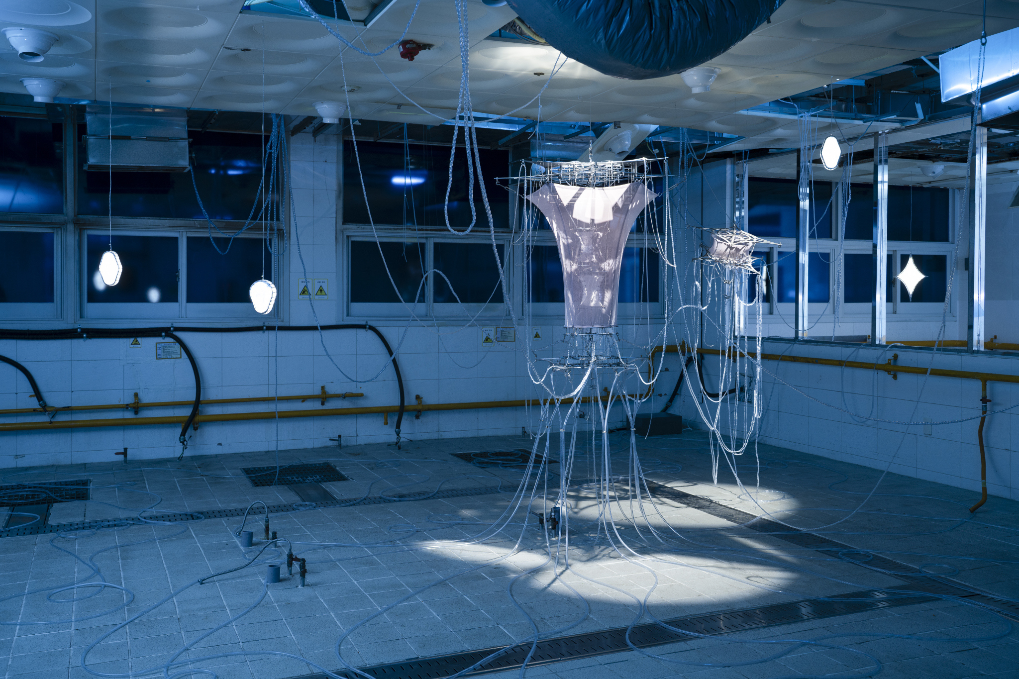 We Were Trembling as If in Cold Water, 2026, two-channel sound installation; fabric, stainless steel, PVC, LED, hose, water pump and air circulation system, dimensions variable. Commissioned by Busan Biennale Organizing Committee, 2026.
