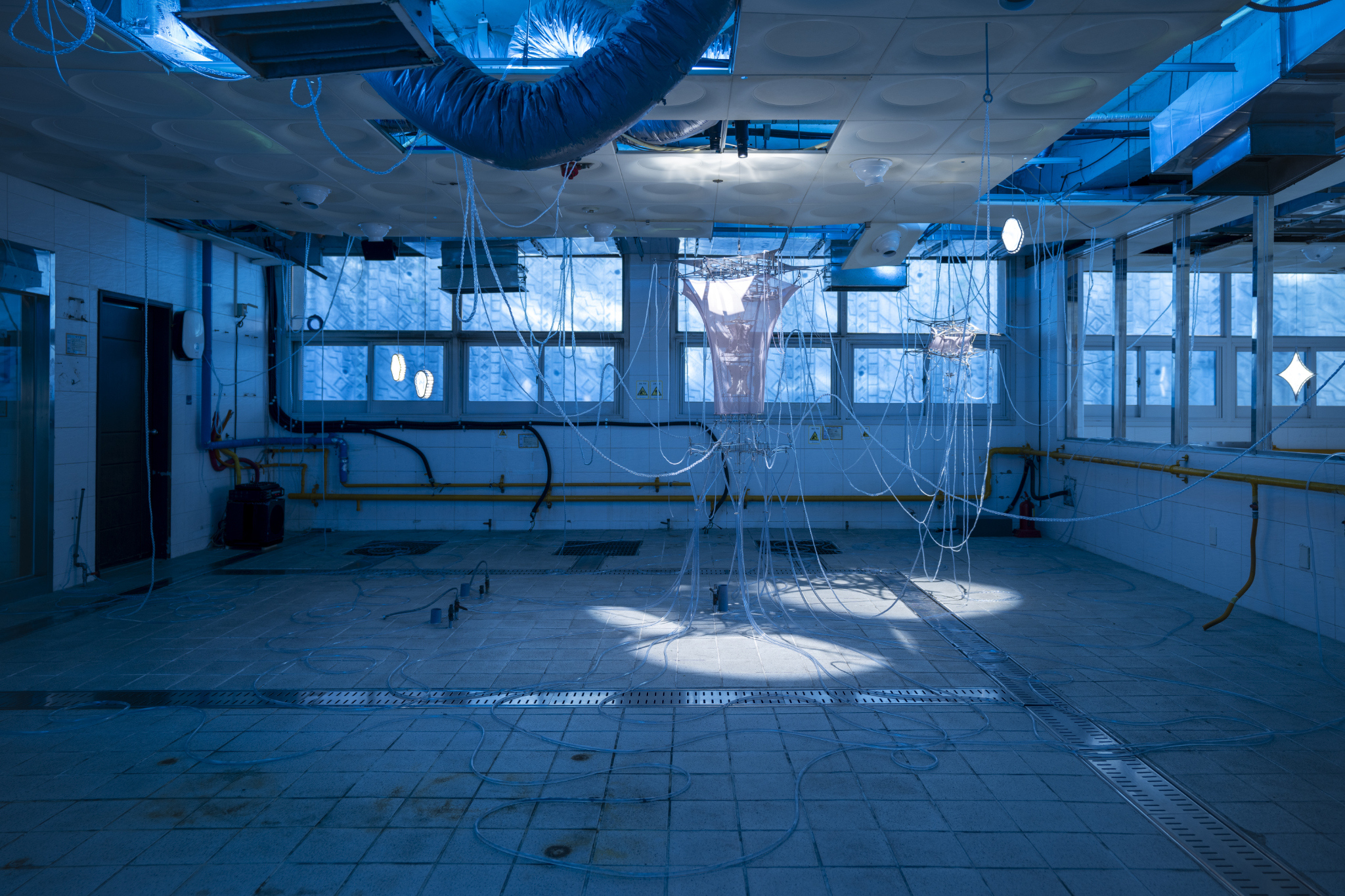 We Were Trembling as If in Cold Water, 2026, two-channel sound installation; fabric, stainless steel, PVC, LED, hose, water pump and air circulation system, dimensions variable. Commissioned by Busan Biennale Organizing Committee, 2026.